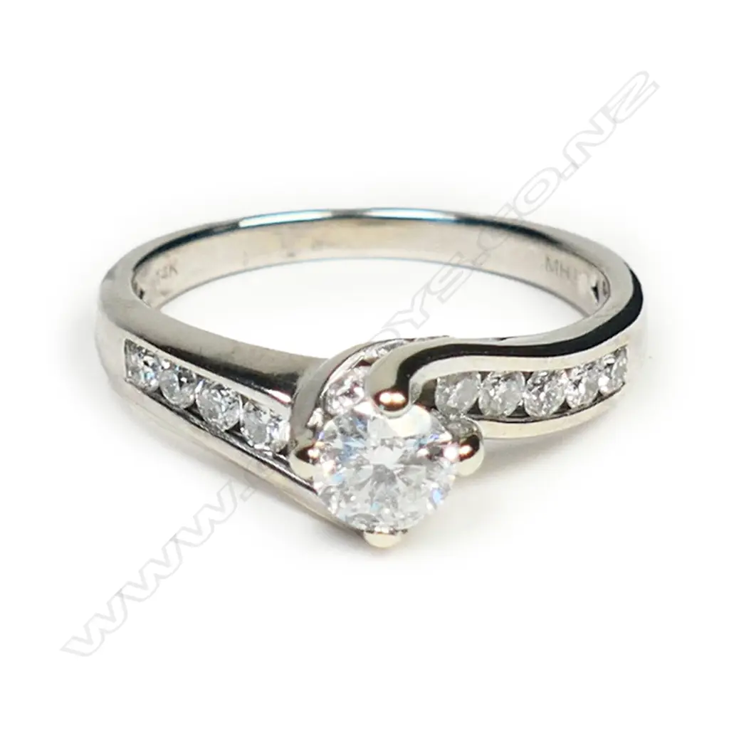 A 14ct white gold and diamond solitaire ring, Image 1++