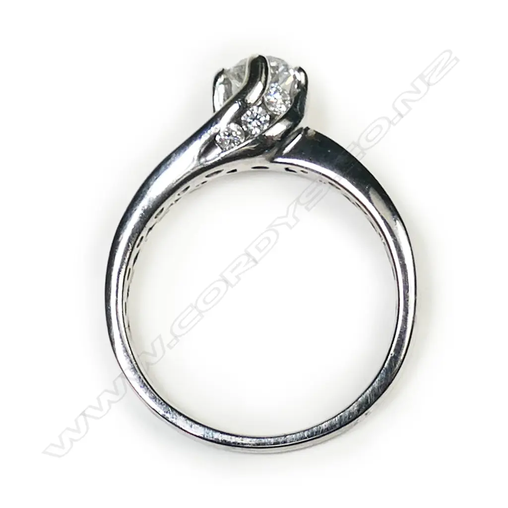 A 14ct white gold and diamond solitaire ring, Image 1++