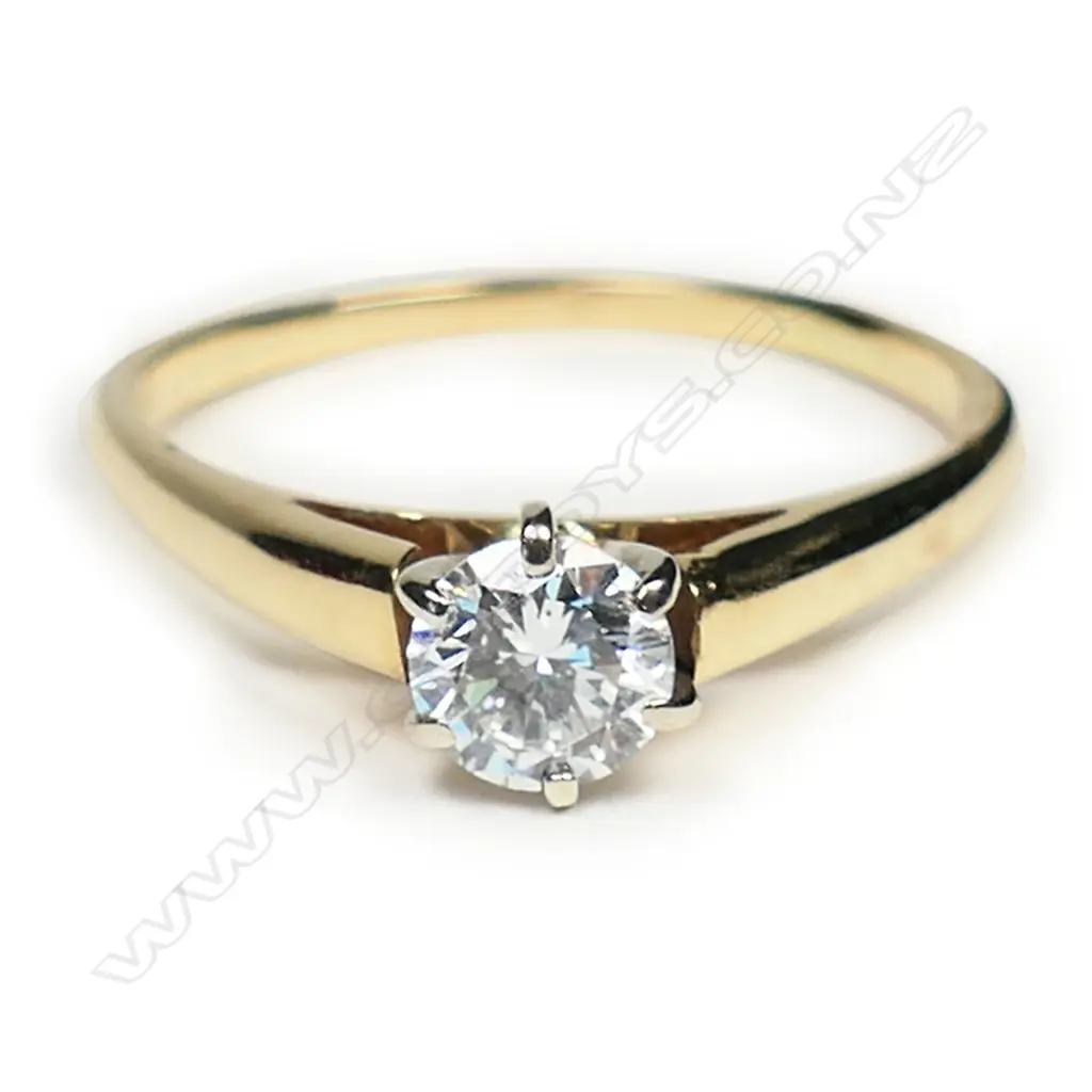 An 18ct gold and diamond solitaire ring, Image 1++