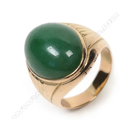A quality jadeite and 14k yellow gold ring,