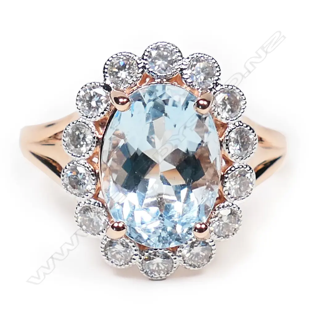 A 14ct rose gold, aquamarine and diamond halo ring, Image 1++