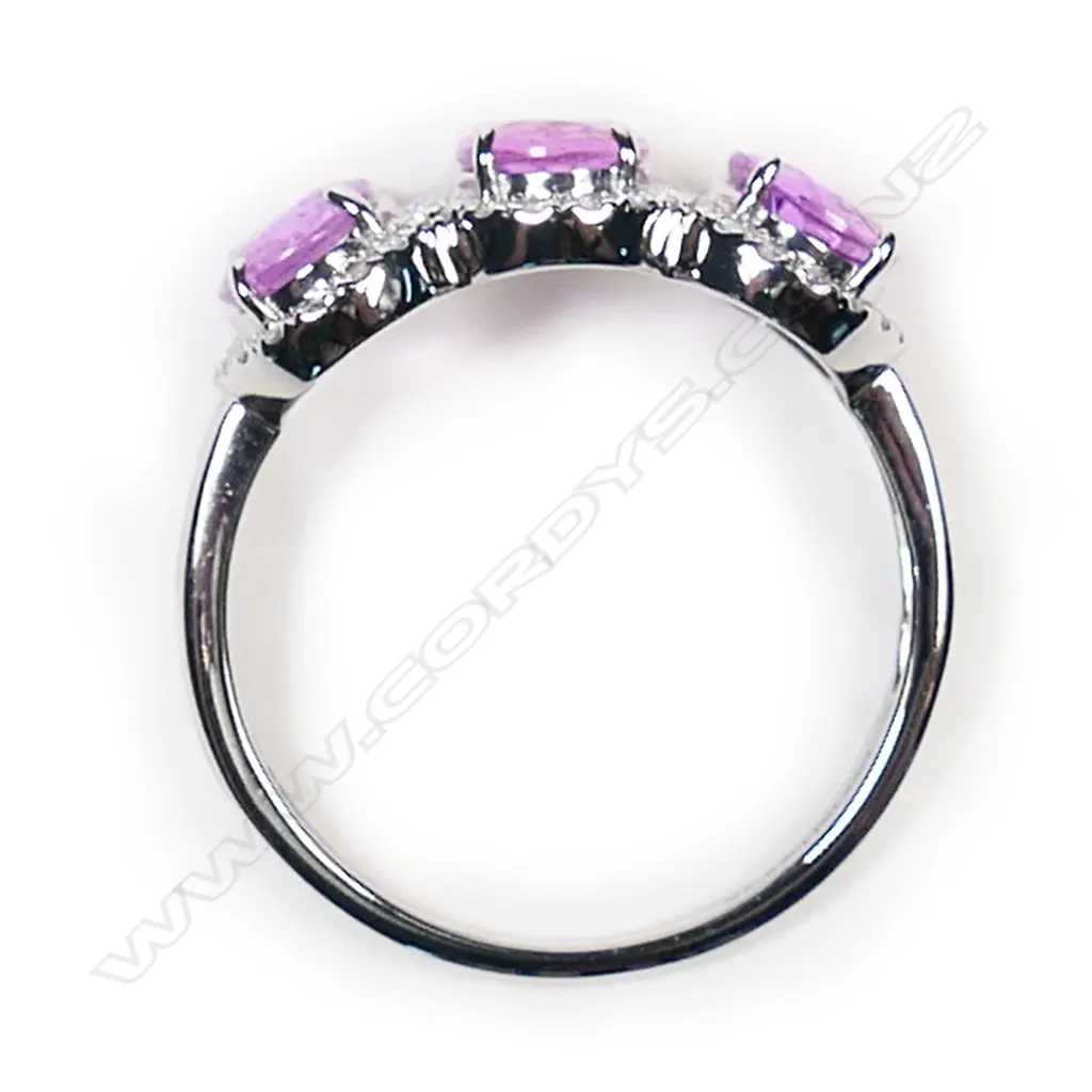 A 14ct white gold pink sapphire and diamond trilogy ring, Image 1++