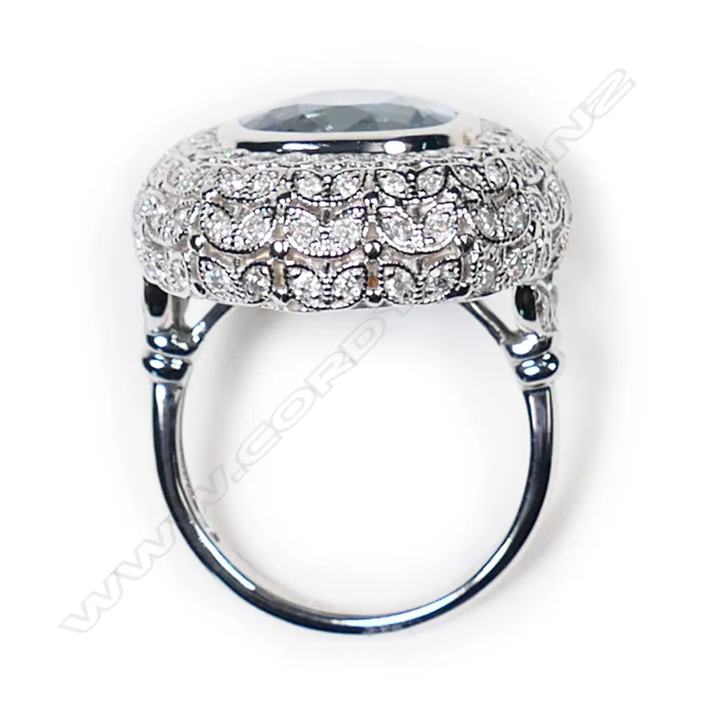 A 14ct white gold, aquamarine and diamond cluster ring, Image 1++