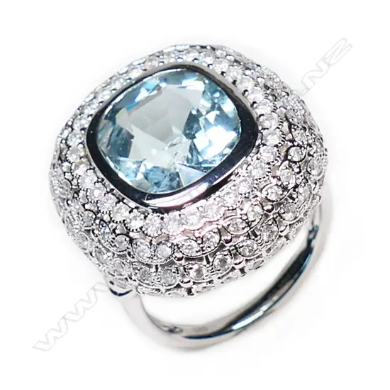 A 14ct white gold, aquamarine and diamond cluster ring,