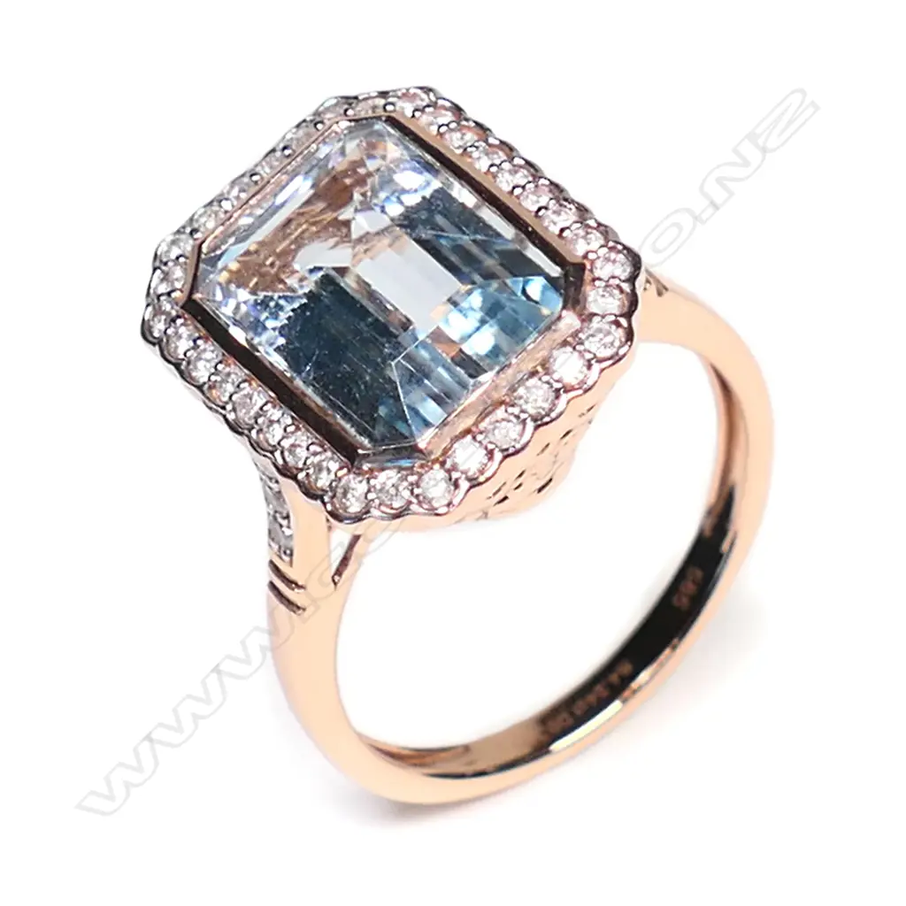 A 14ct white gold, aquamarine and diamond halo ring, Image 1++