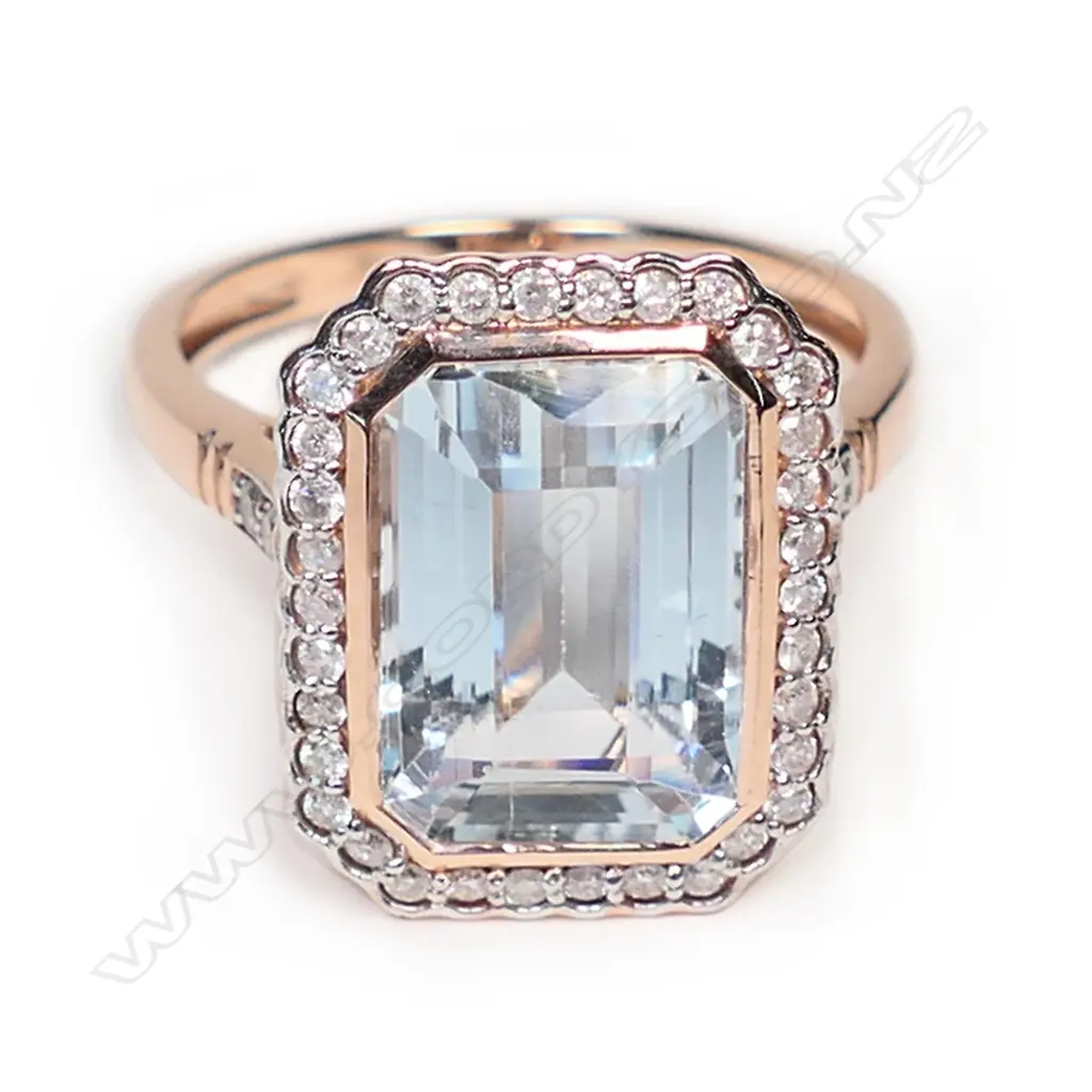 A 14ct white gold, aquamarine and diamond halo ring, Image 1++