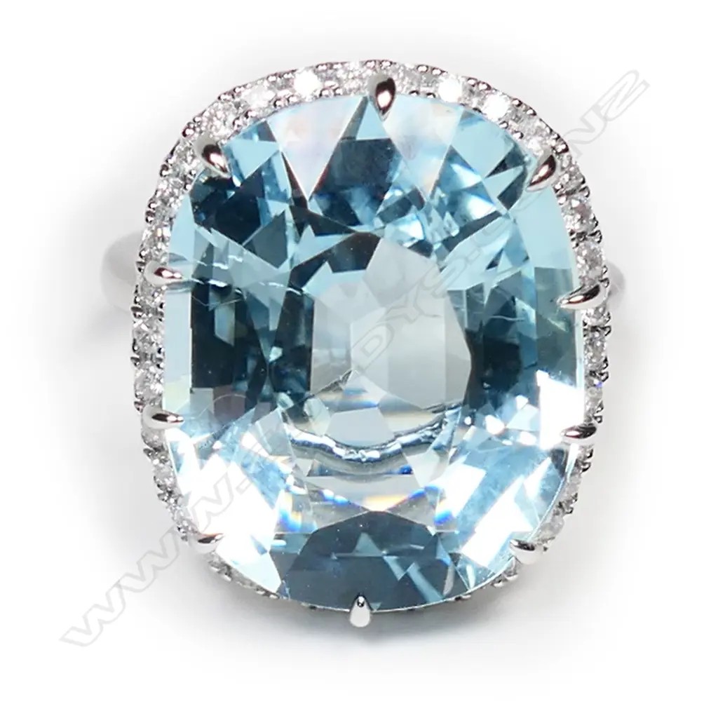 A 14ct white gold, aquamarine and diamond halo ring, Image 1++