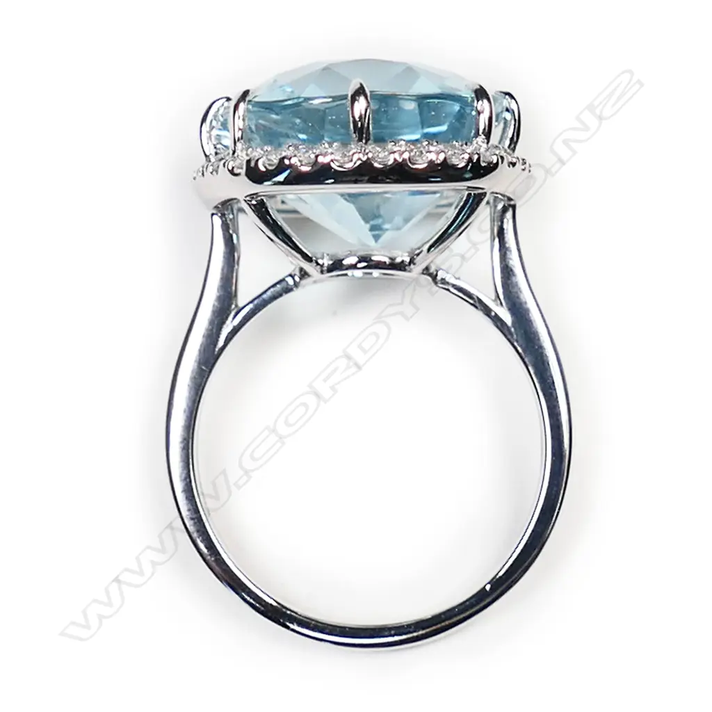 A 14ct white gold, aquamarine and diamond halo ring, Image 1++