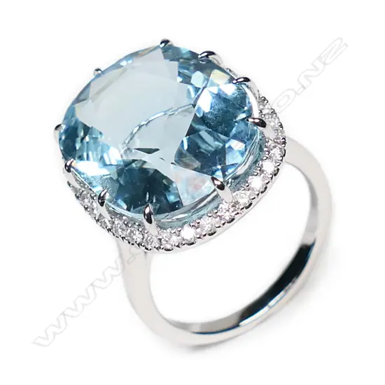 A 14ct white gold, aquamarine and diamond halo ring,