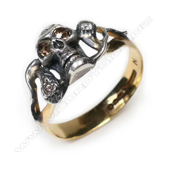 A vintage 22ct gold, silver and diamond skull and snake ring,