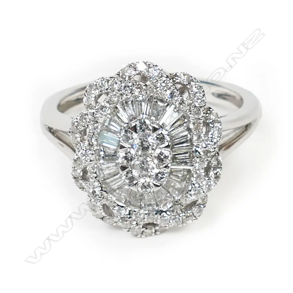 An 18ct white gold and diamond cluster ring, Image 1++