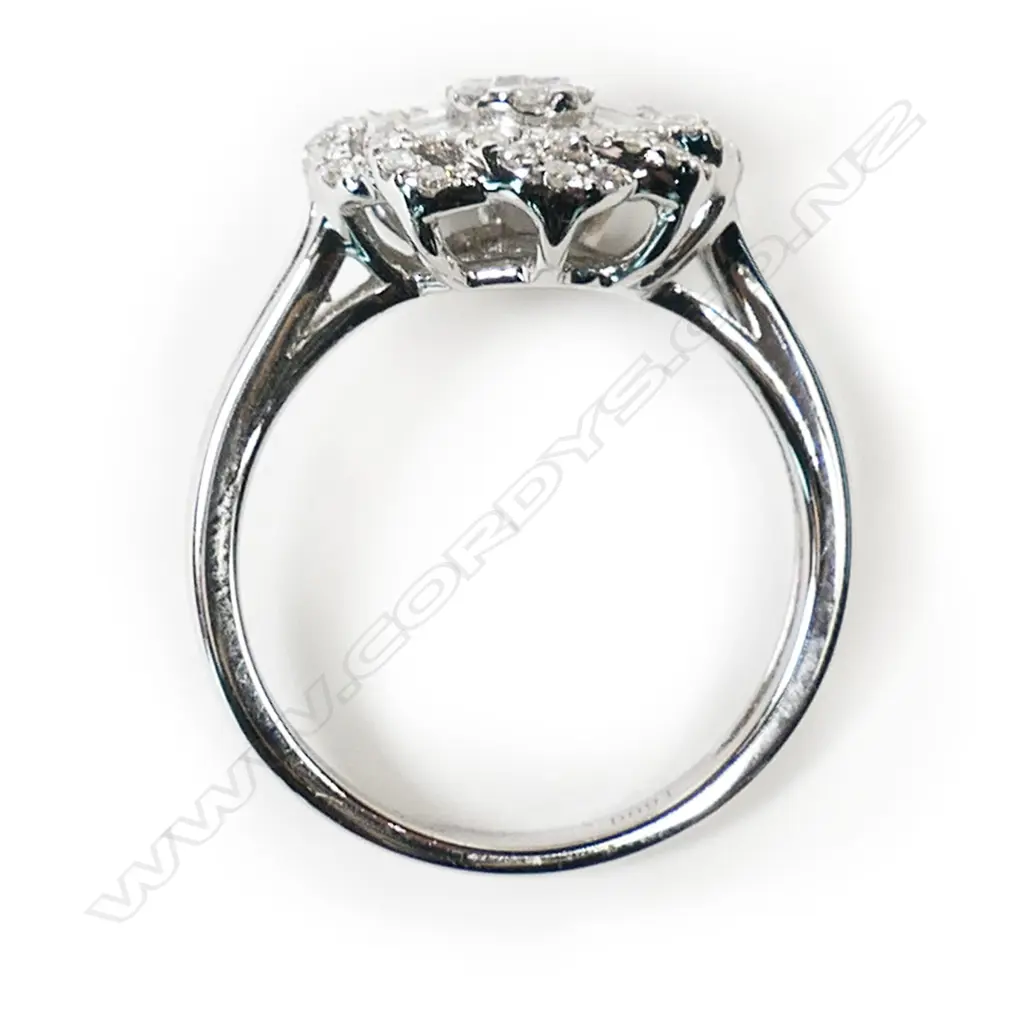 An 18ct white gold and diamond cluster ring, Image 1++