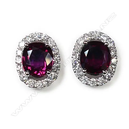 A pair of 18ct white gold, ruby and diamond cluster earrings,