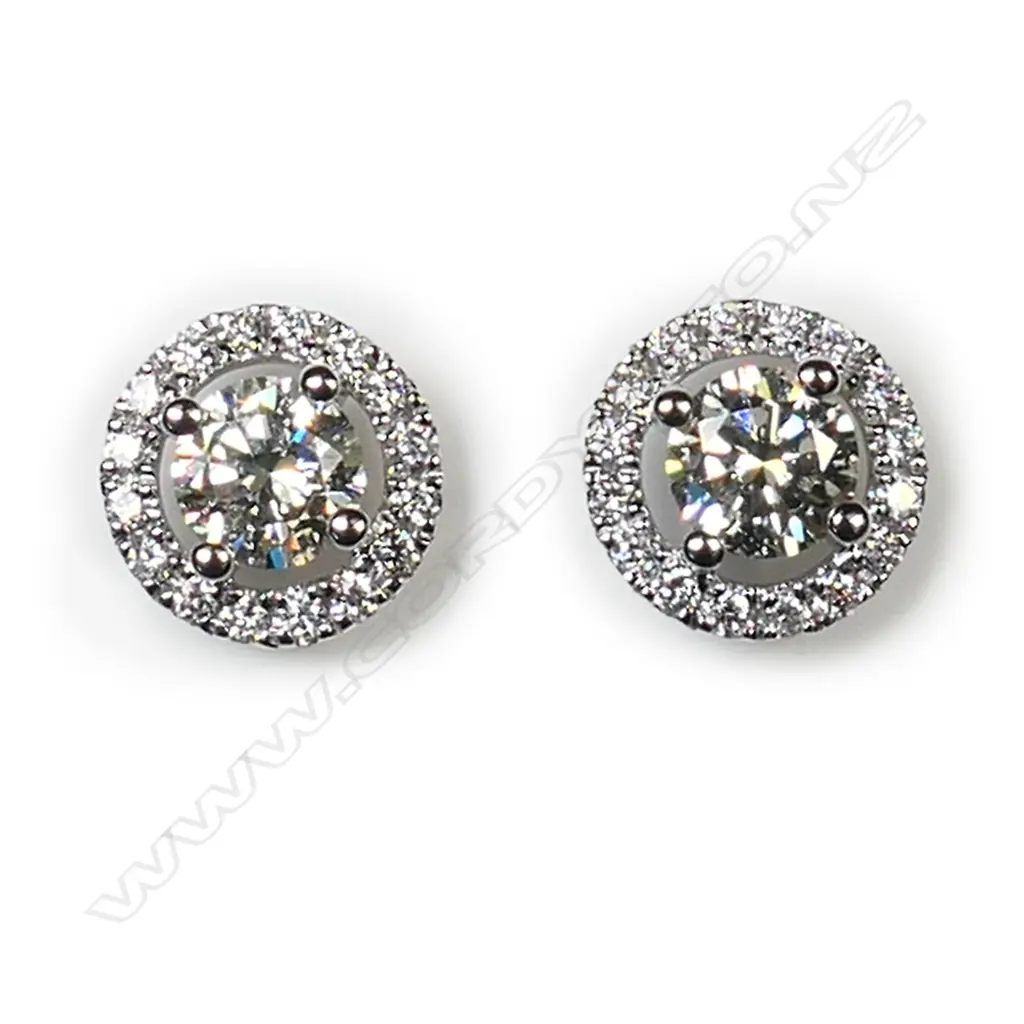 A pair of 18ct white gold and diamond cluster earrings, Image 1++