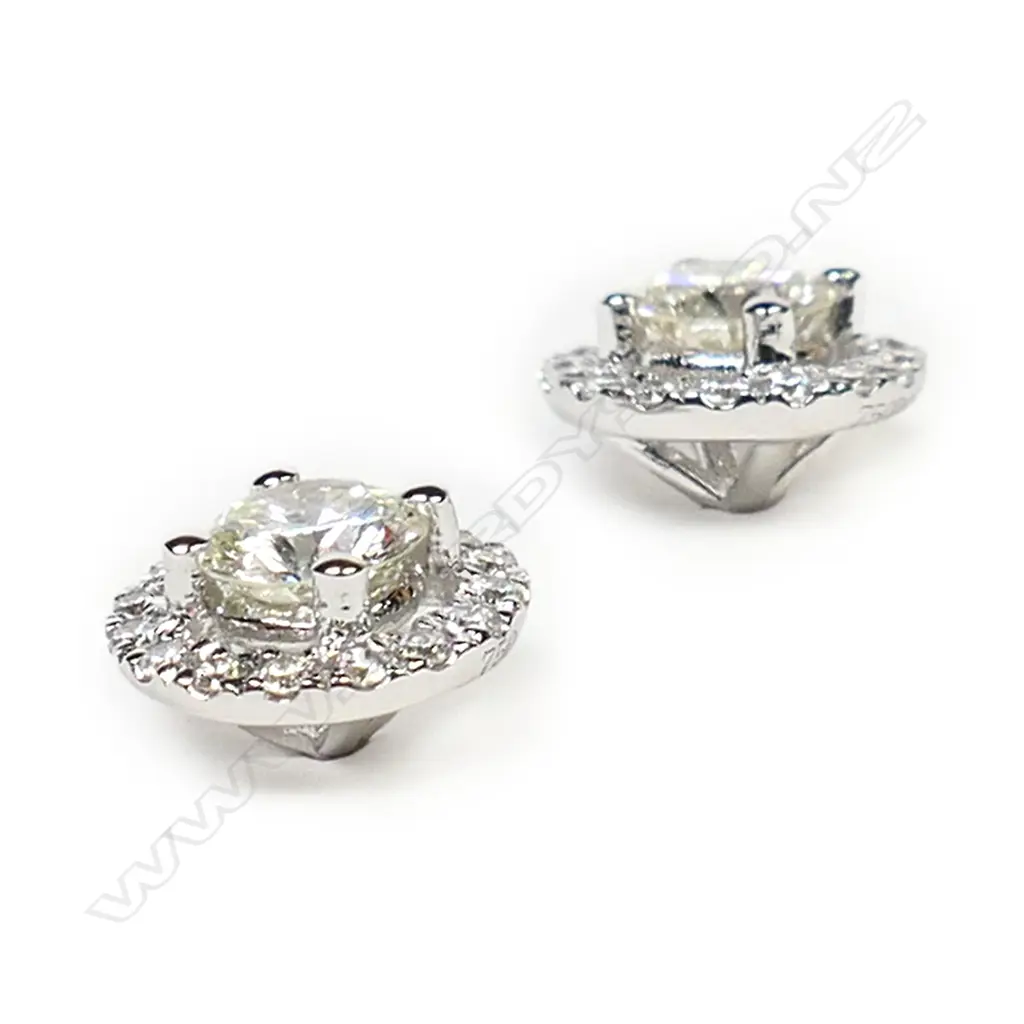 A pair of 18ct white gold and diamond cluster earrings, Image 1++