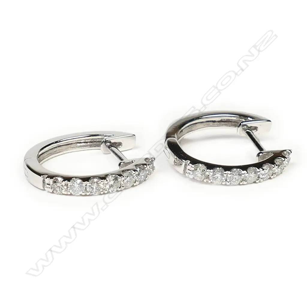 A pair of 18ct white gold and diamond earrings, Image 1++