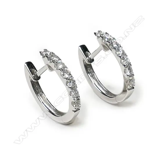 A pair of 18ct white gold and diamond earrings,