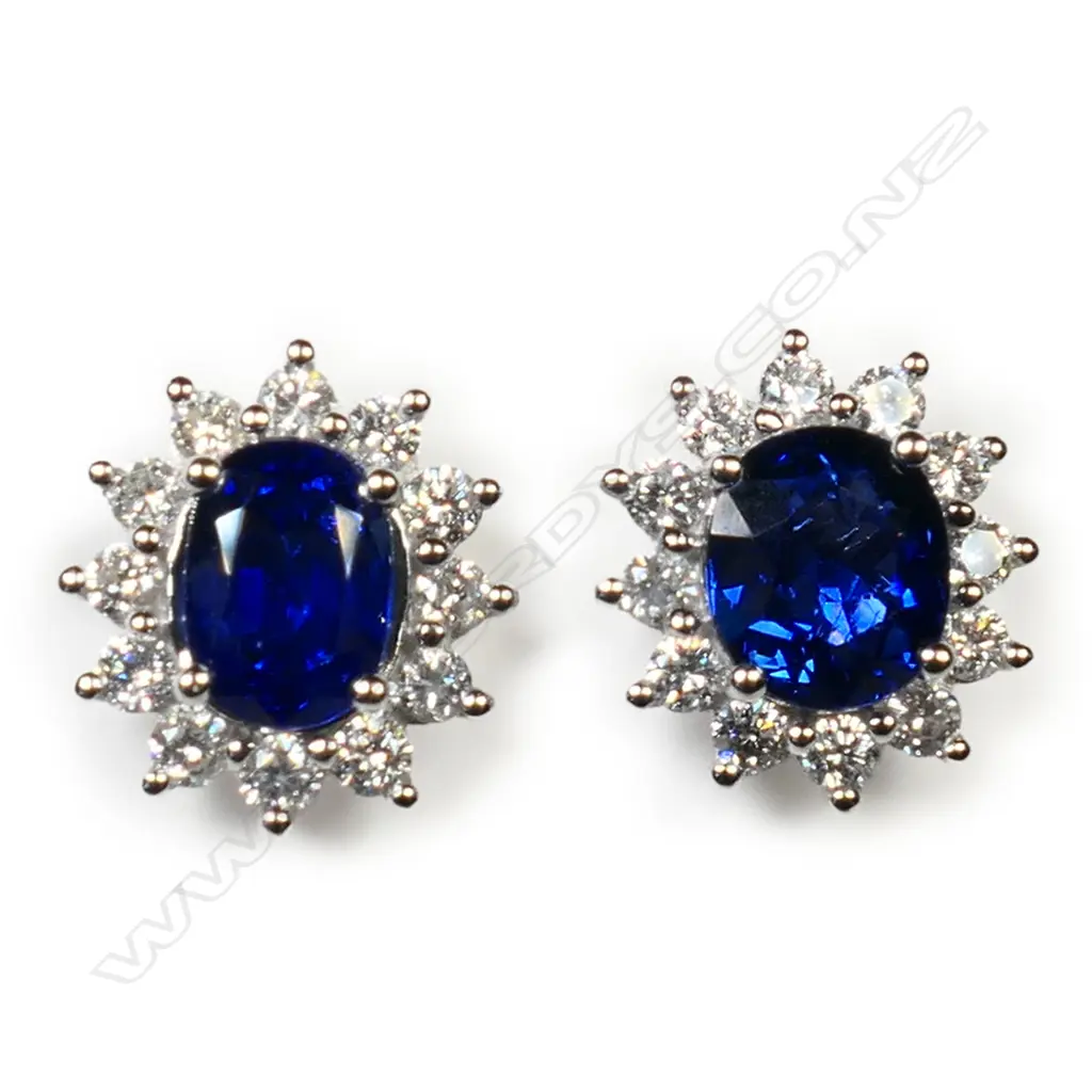 #A pair of 18ct white gold sapphire and diamond cluster earrings, Image 1++