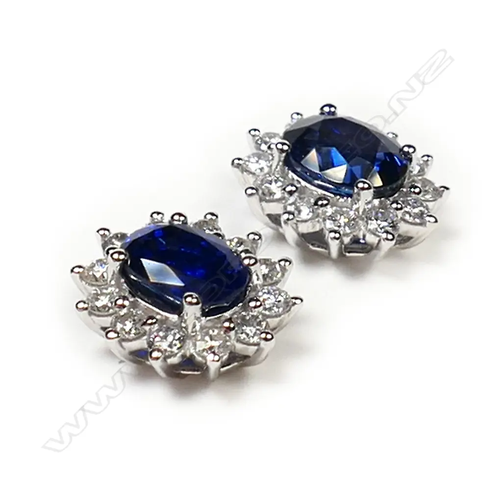 #A pair of 18ct white gold sapphire and diamond cluster earrings, Image 1++