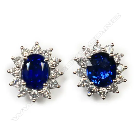 #A pair of 18ct white gold sapphire and diamond cluster earrings,