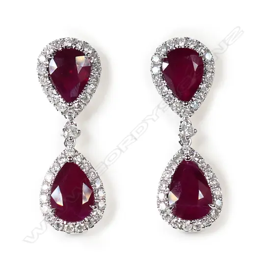$ A pair of 14ct white gold Burmese ruby and diamond drop earrings,