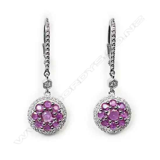 A pair of 14ct white gold, ruby and diamond drop earrings,
