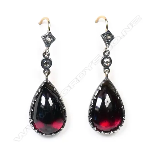 A pair of gold, silver garnet and diamond earrings,