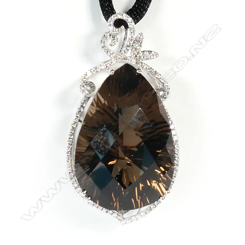 An 18ct white gold and large smoky quartz and diamond set pendant, Image 1++