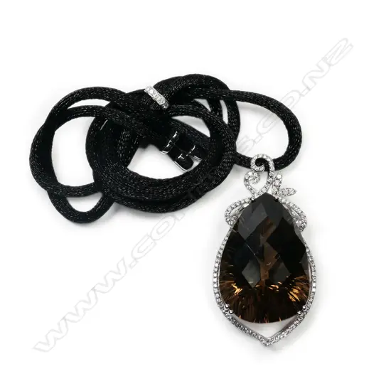 An 18ct white gold and large smoky quartz and diamond set pendant,