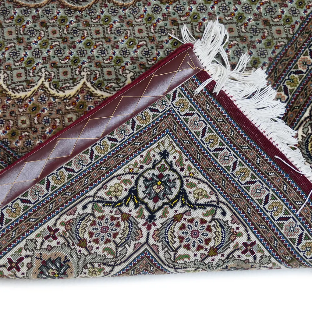 #A fine hand knotted Tabriz rug Image 1++