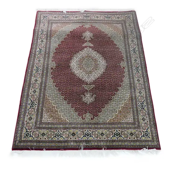 #A fine hand knotted Tabriz rug