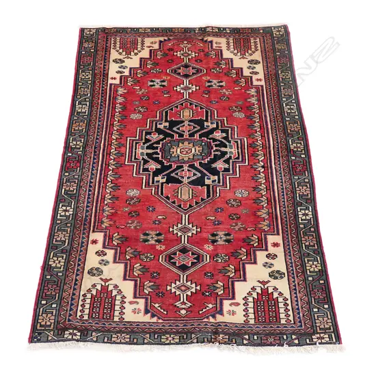 An Iranian Hamadan hand knotted rug,