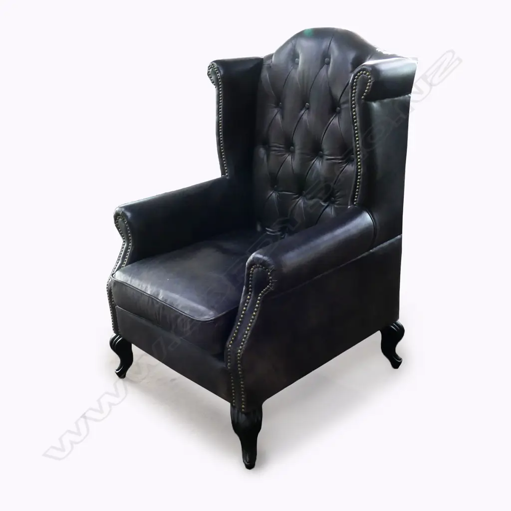 A leather wing back armchair, Image 1++