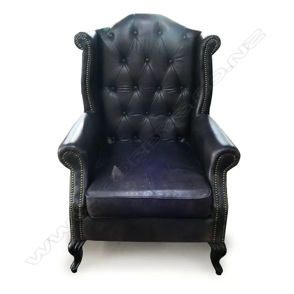 A leather wing back armchair, Image 1++