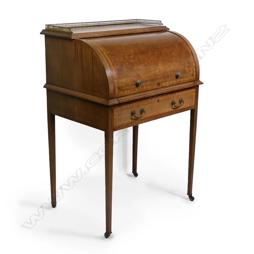 An Edwardian mahogany Sheraton revival drum front desk, Image 1++