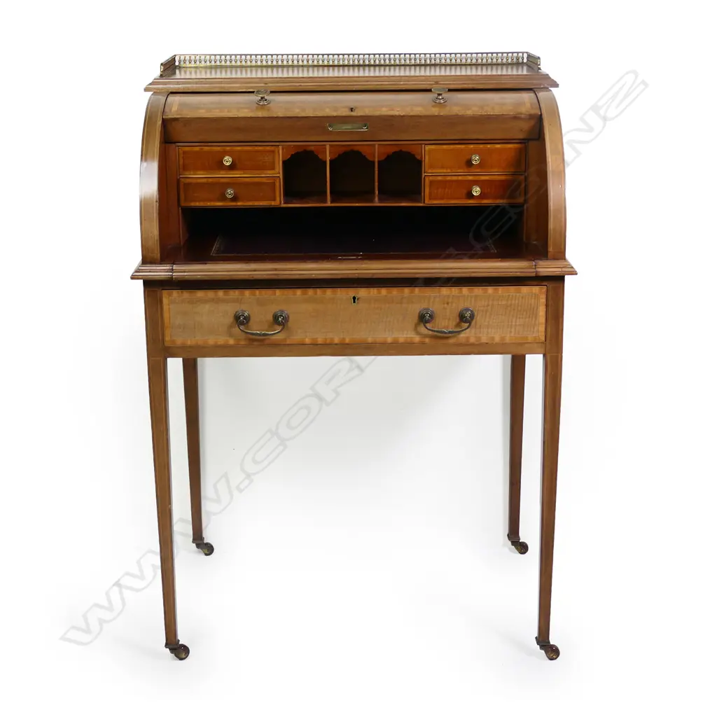 An Edwardian mahogany Sheraton revival drum front desk, Image 1++
