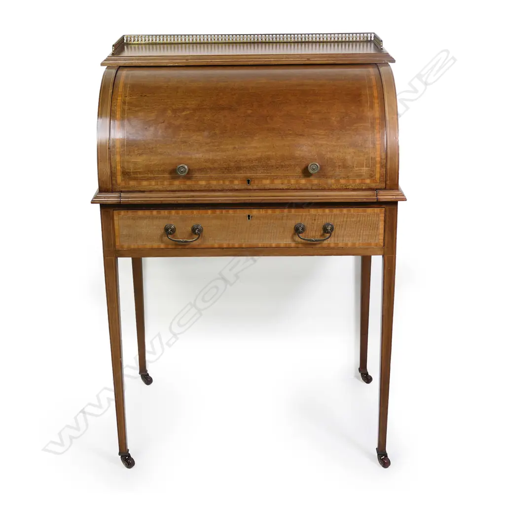 An Edwardian mahogany Sheraton revival drum front desk, Image 1++
