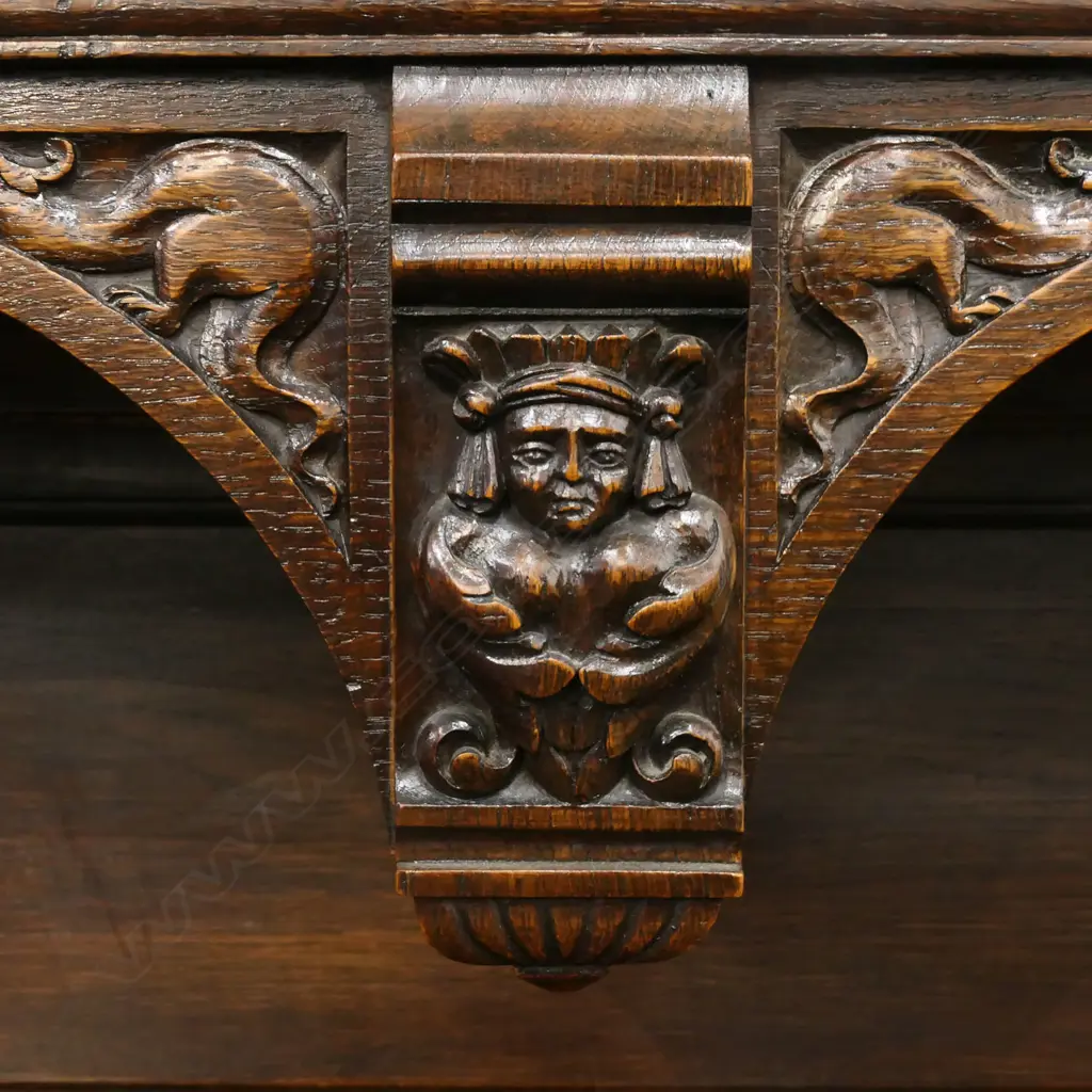 A 19thC oak Continental sideboard, two half drawers over two elaborately carved doors, shelf to base with conforming carved detail. 1280 x 500 x 1400mm. Image 1++