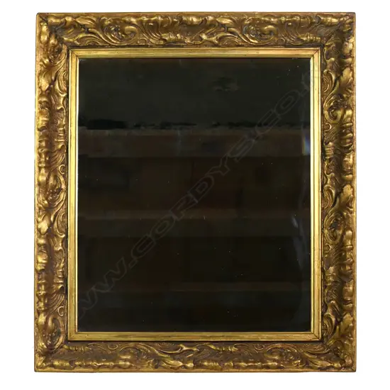 A large gilt framed mirror,