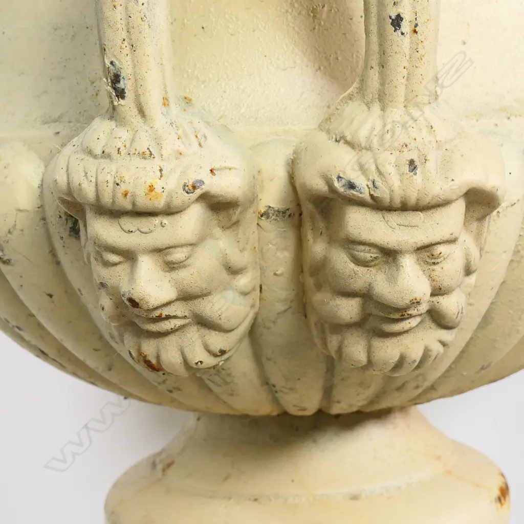 A pair of cast iron garden urns on plinths, Image 1++