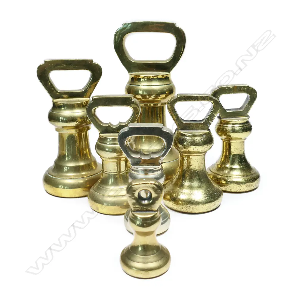 A harlequin set of seven brass Avery bell weights, Image 1++