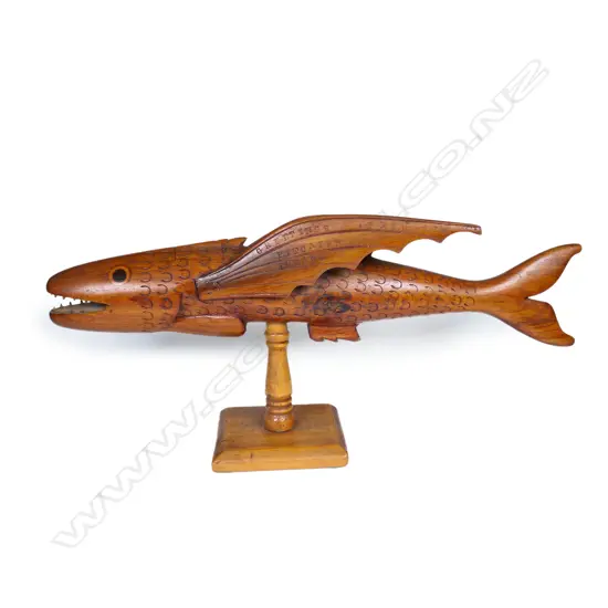 A vintage Pitcairn Island carved wood flying fish sculpture,