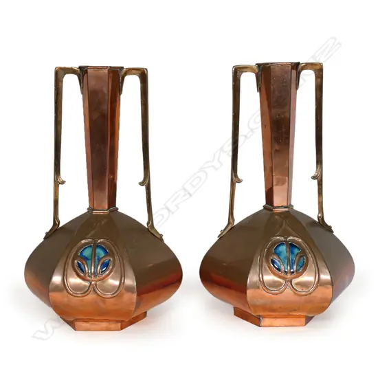 A pair of Arts & Crafts copper vases,