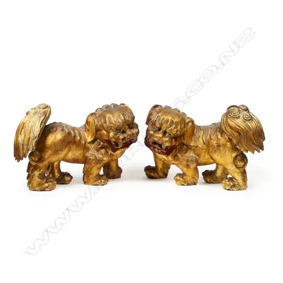 A pair of gilded wood Chinese Fu dogs,