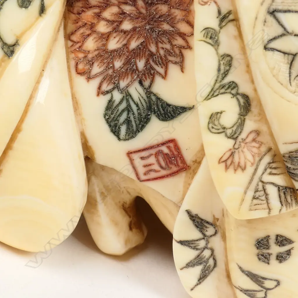 A Japanese carved and stained ivory erotic figure group, Image 1++
