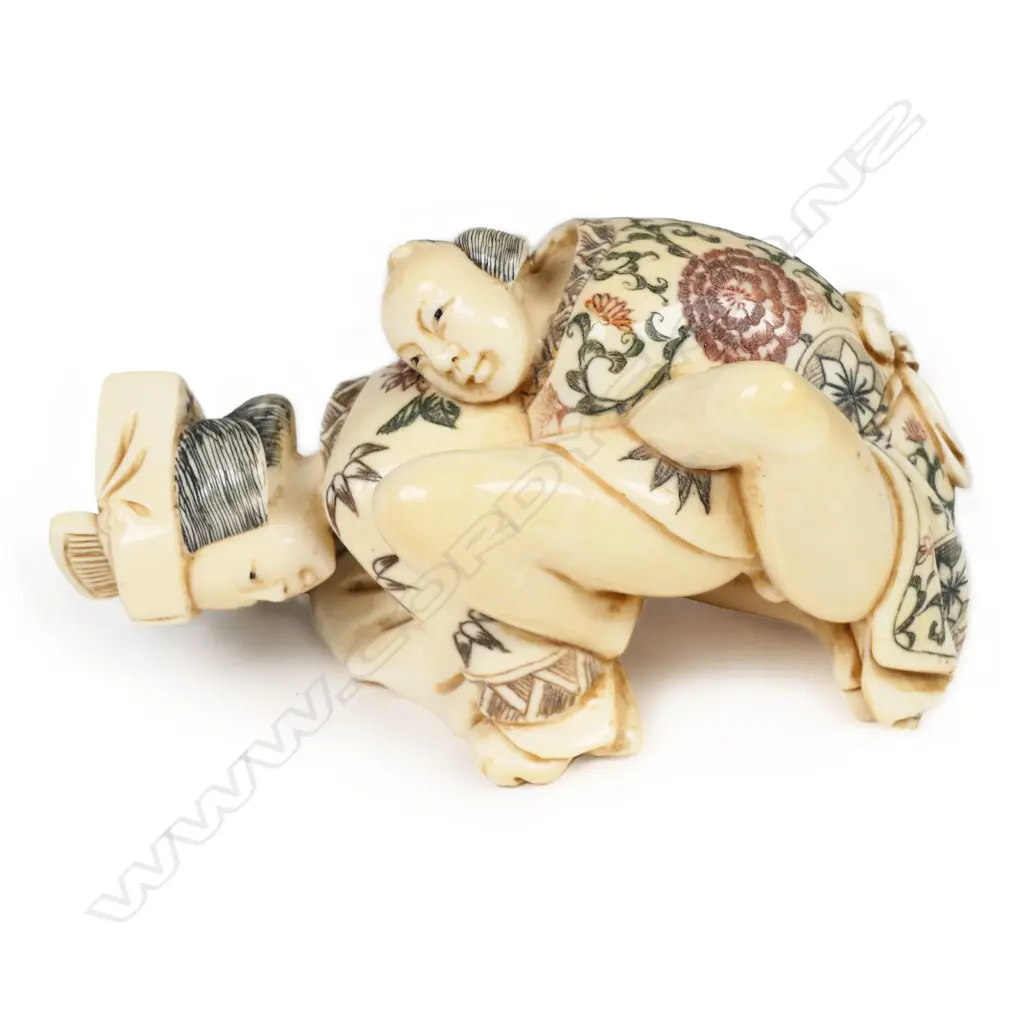 A Japanese carved and stained ivory erotic figure group, Image 1++