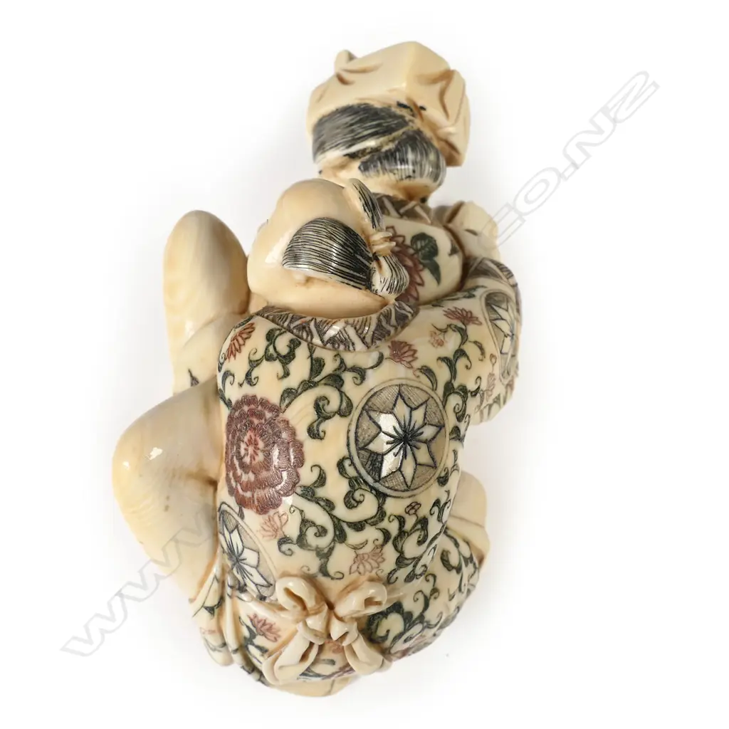 A Japanese carved and stained ivory erotic figure group, Image 1++
