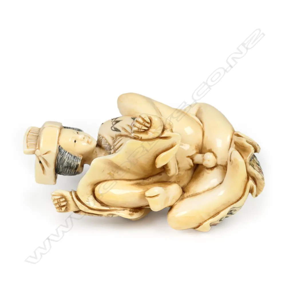 A Japanese carved and stained ivory erotic figure group, Image 1++