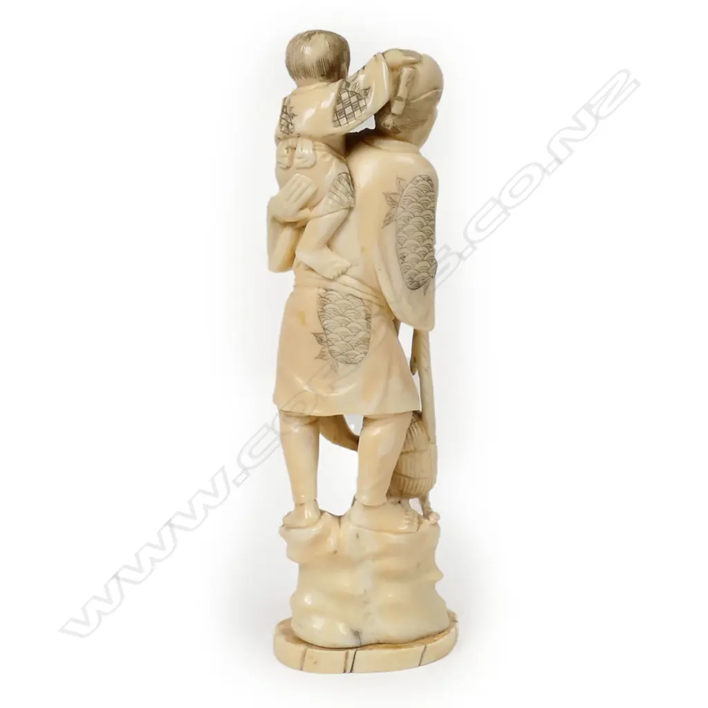 A late 19thC marine ivory carved figure group of a fisherman, Image 1++