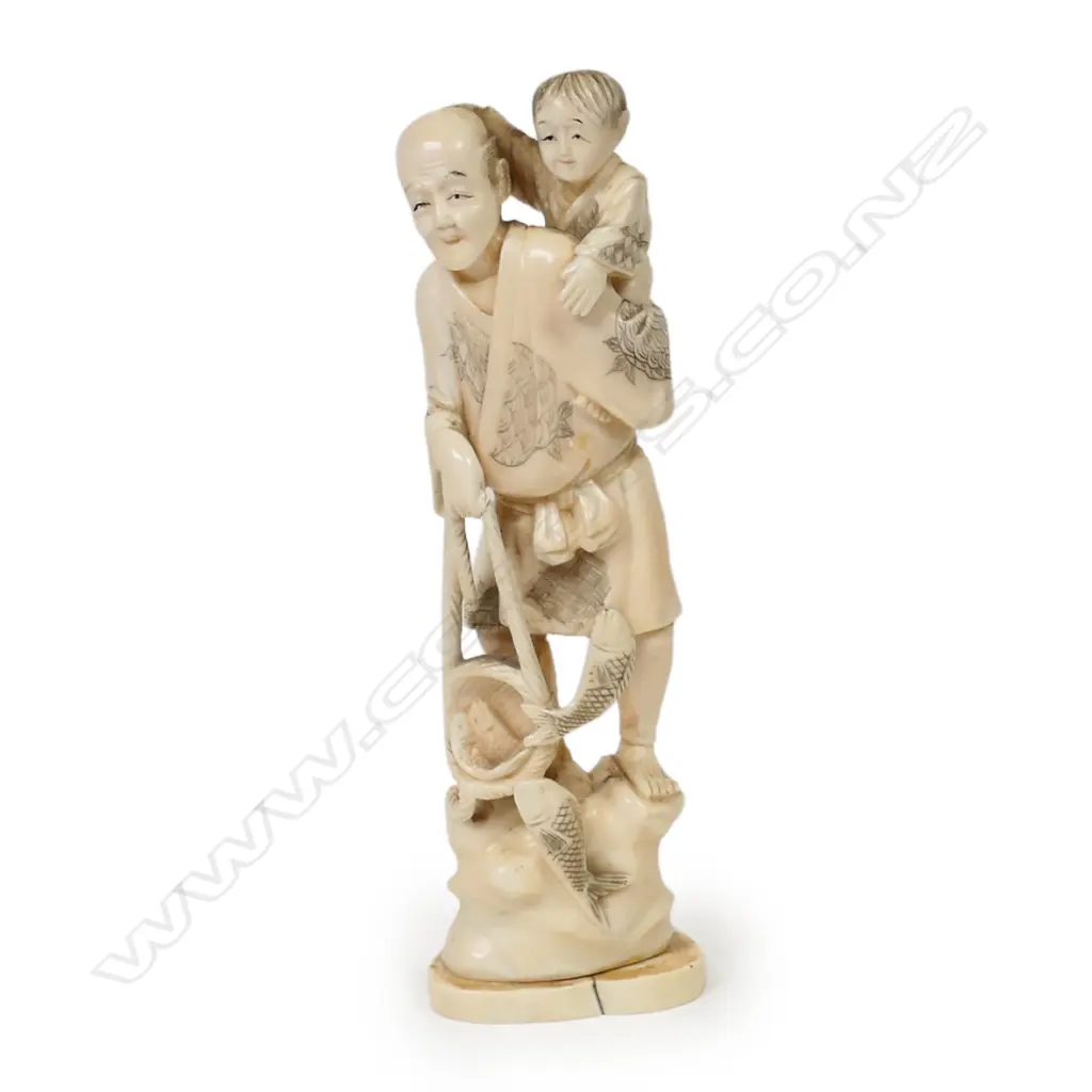 A late 19thC marine ivory carved figure group of a fisherman, Image 1++